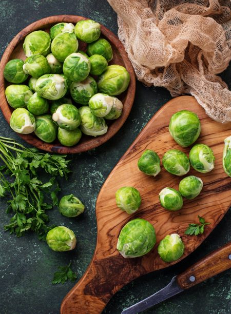 Brussels sprouts on green concrete background